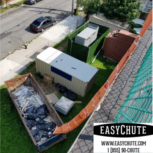 Easy Chute on a construction roofing job removing roofing trash, with our roofing chute.